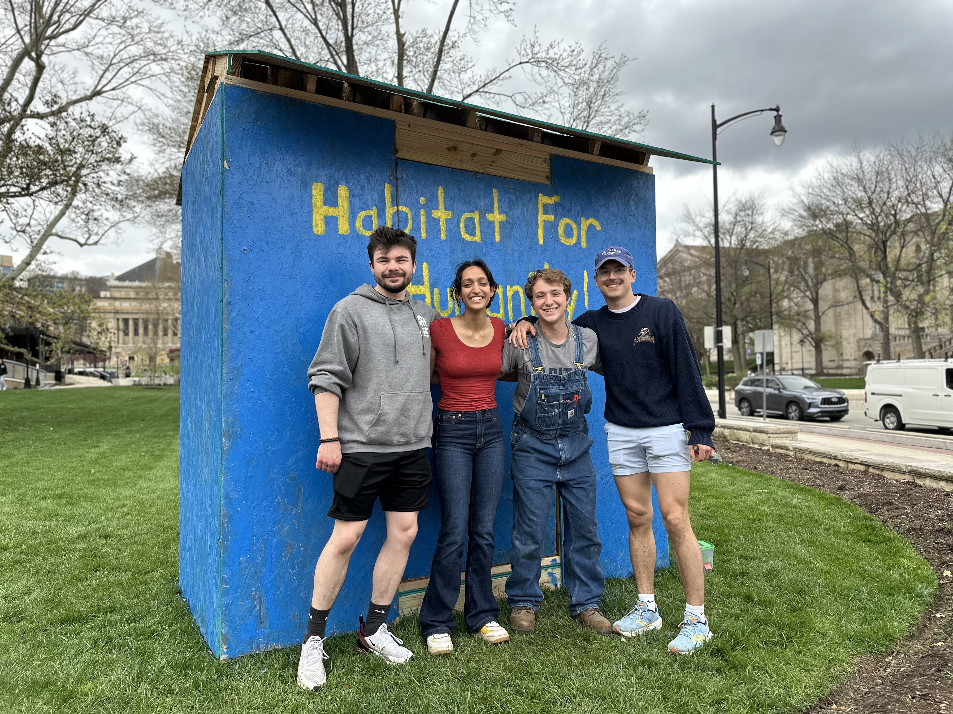 Building the habishack on the WPU lawn for awareness.