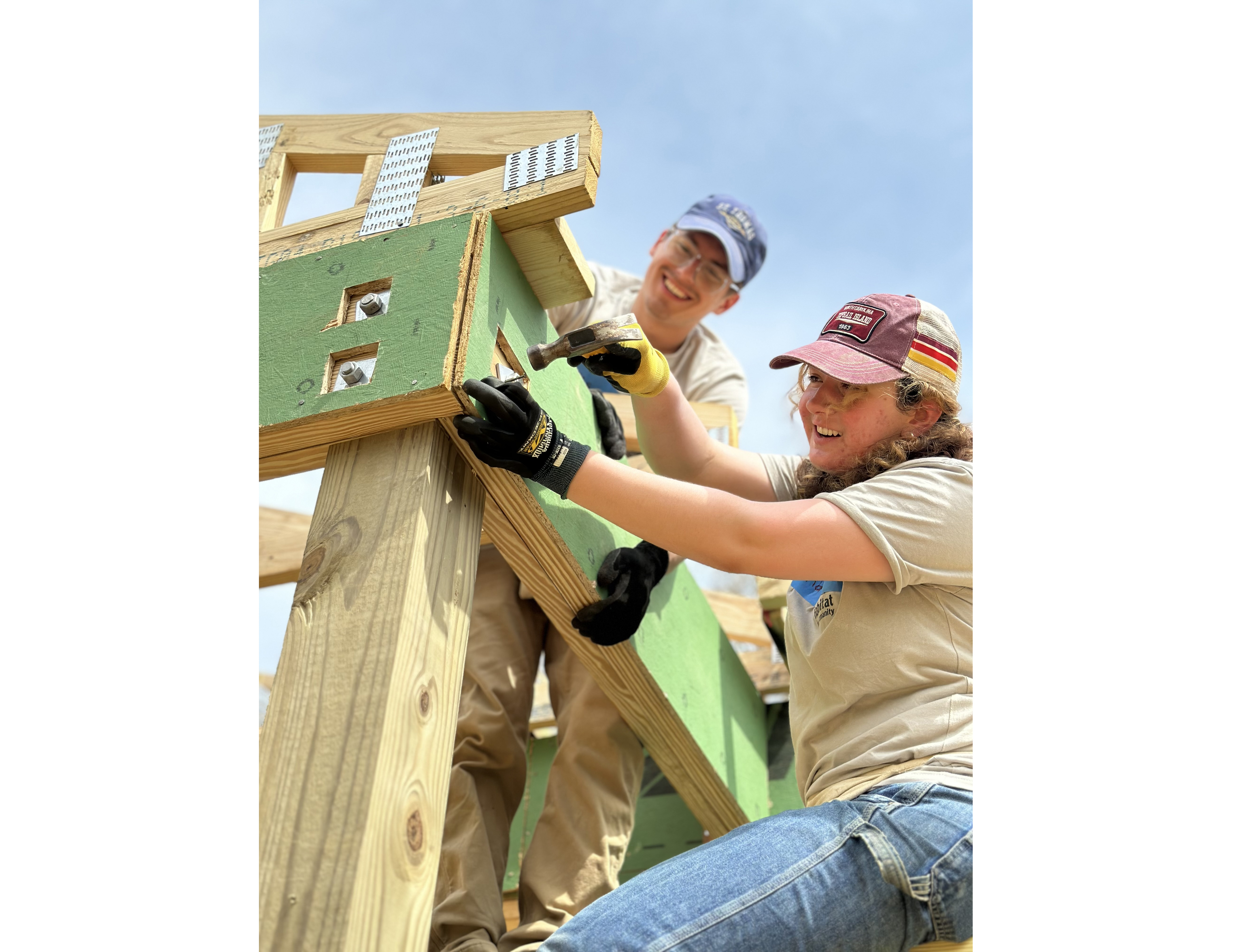 Volunteers installing green board at a house in Cape Fear, NC.
