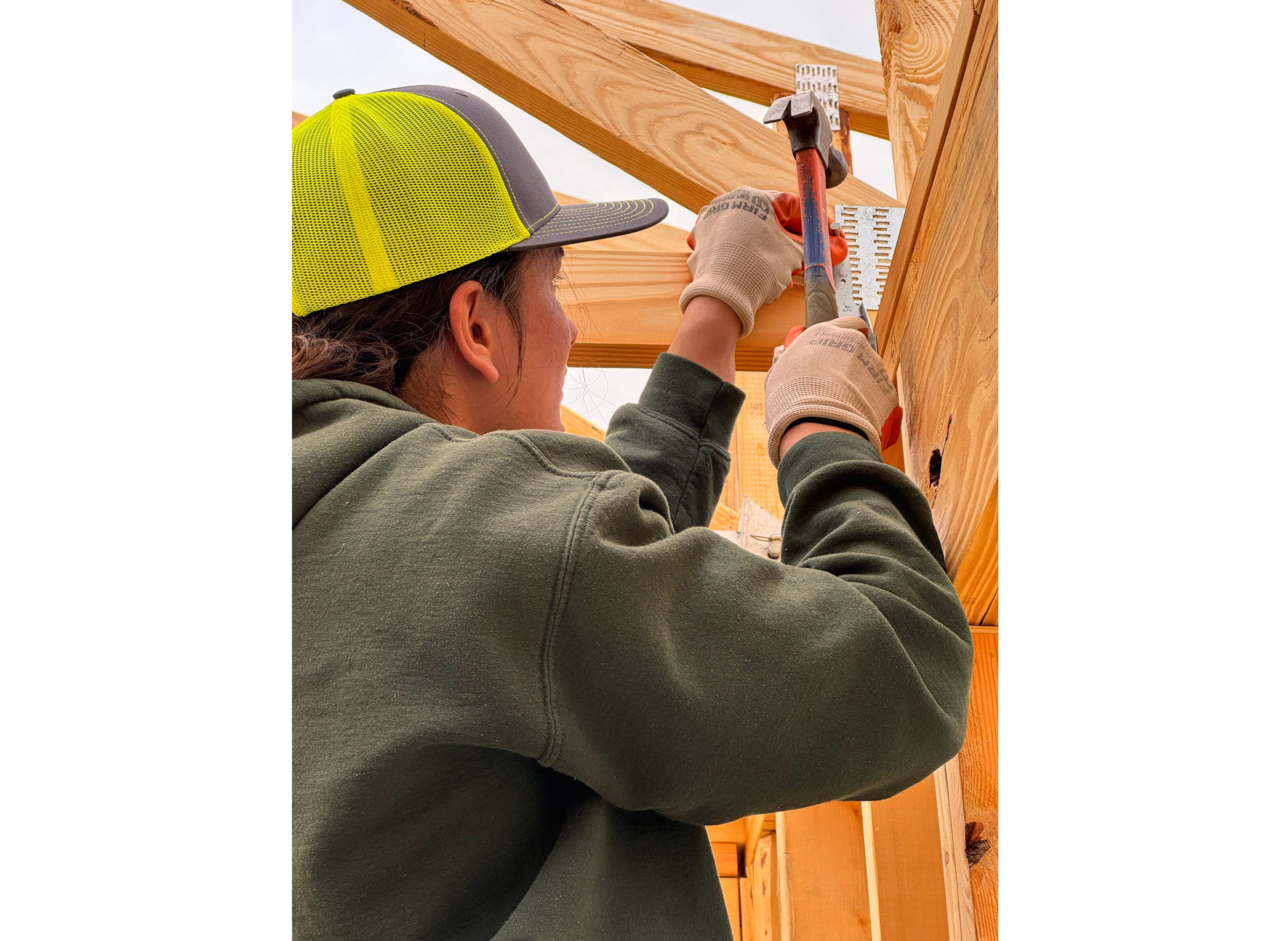 Volunteer installing hurricane straps at a house in Cape Fear, NC.