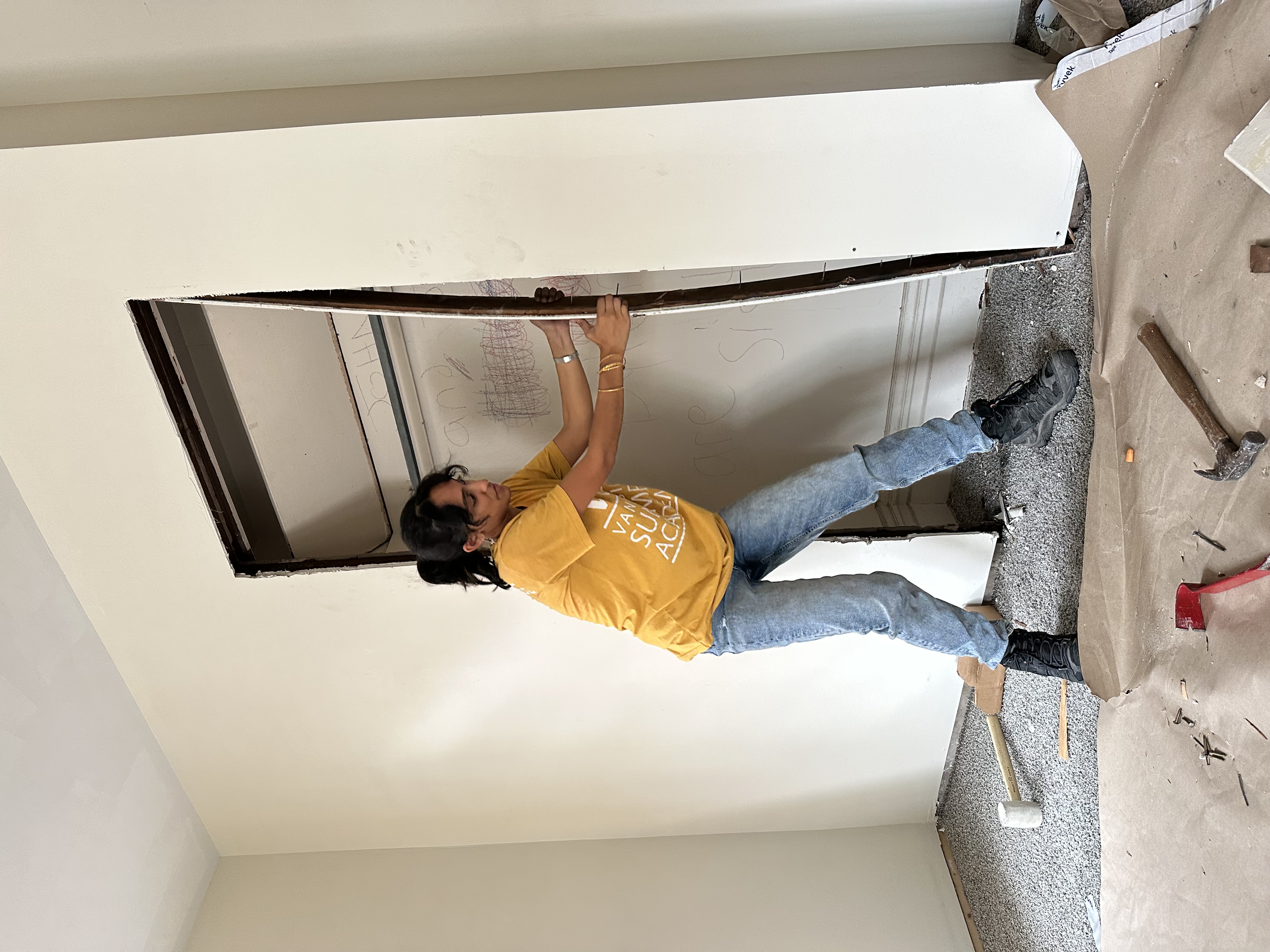 Volunteer doing demolition work at our Armstrong County Habitat for Humanity workday.